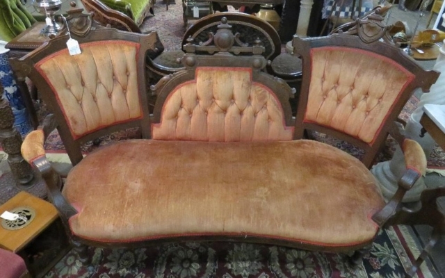 Victorian walnut loveseat with tufted upholstery